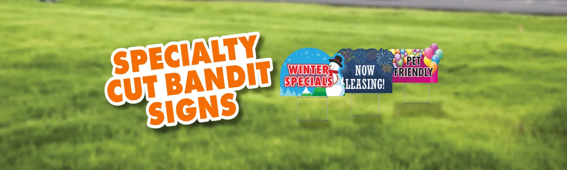 Specialty cut bandit signs on grass.