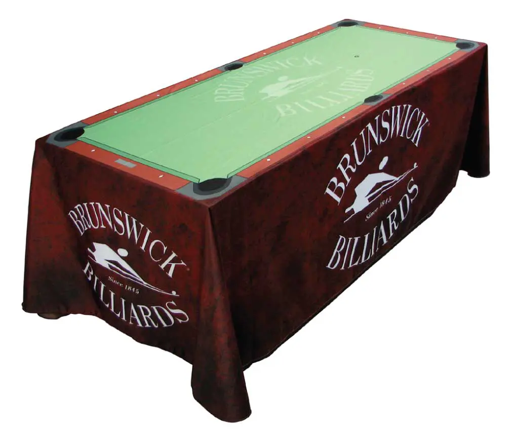 Brunswick billiards table with cover.