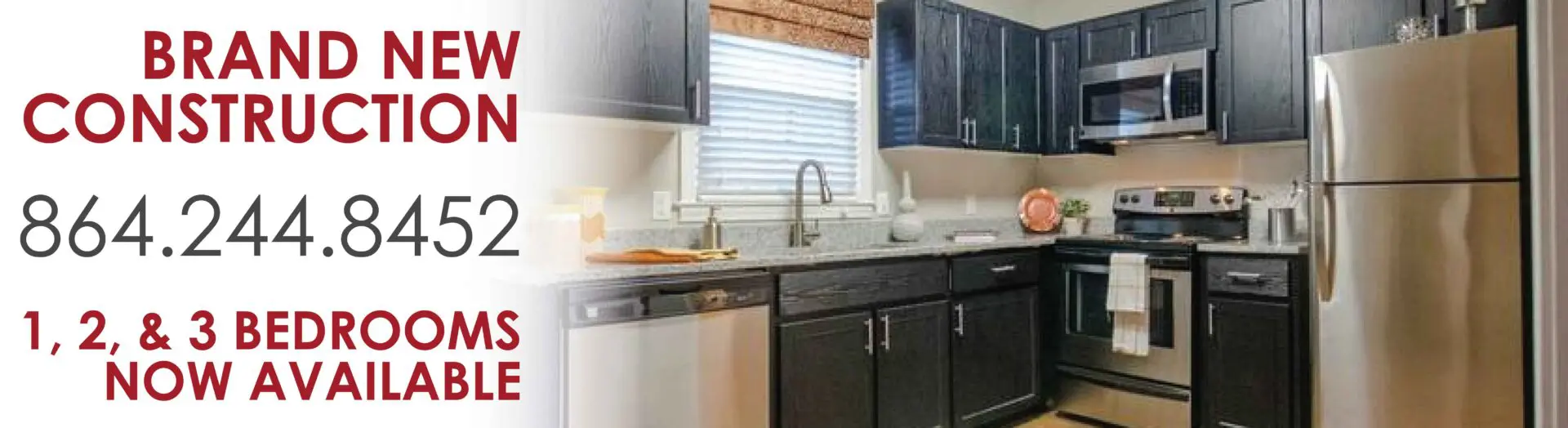 Kitchen with modern appliances and contact information.