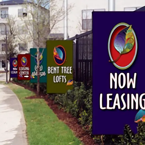 Apartment complex signs, "Now Leasing" visible.