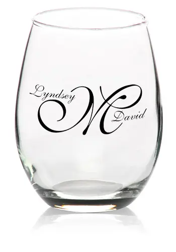 Personalized glass with decorative initials and names.