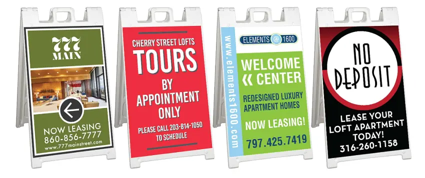 Four promotional sandwich board signs for leasing.