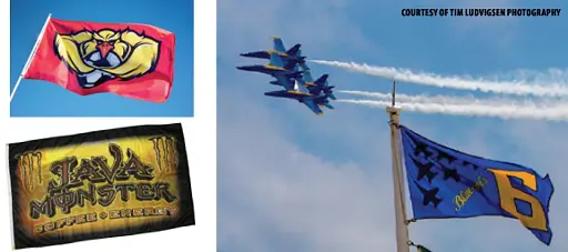 Flags and jets in clear blue sky.