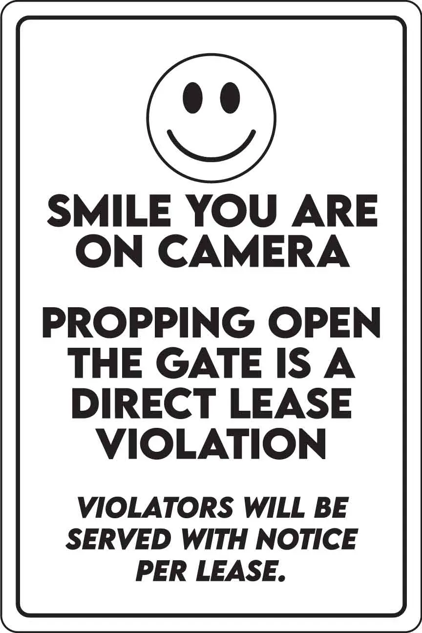 Smile, gate lease violation warning sign.