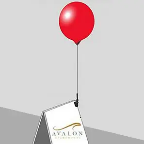 Red balloon on Avalon advertisement stand.